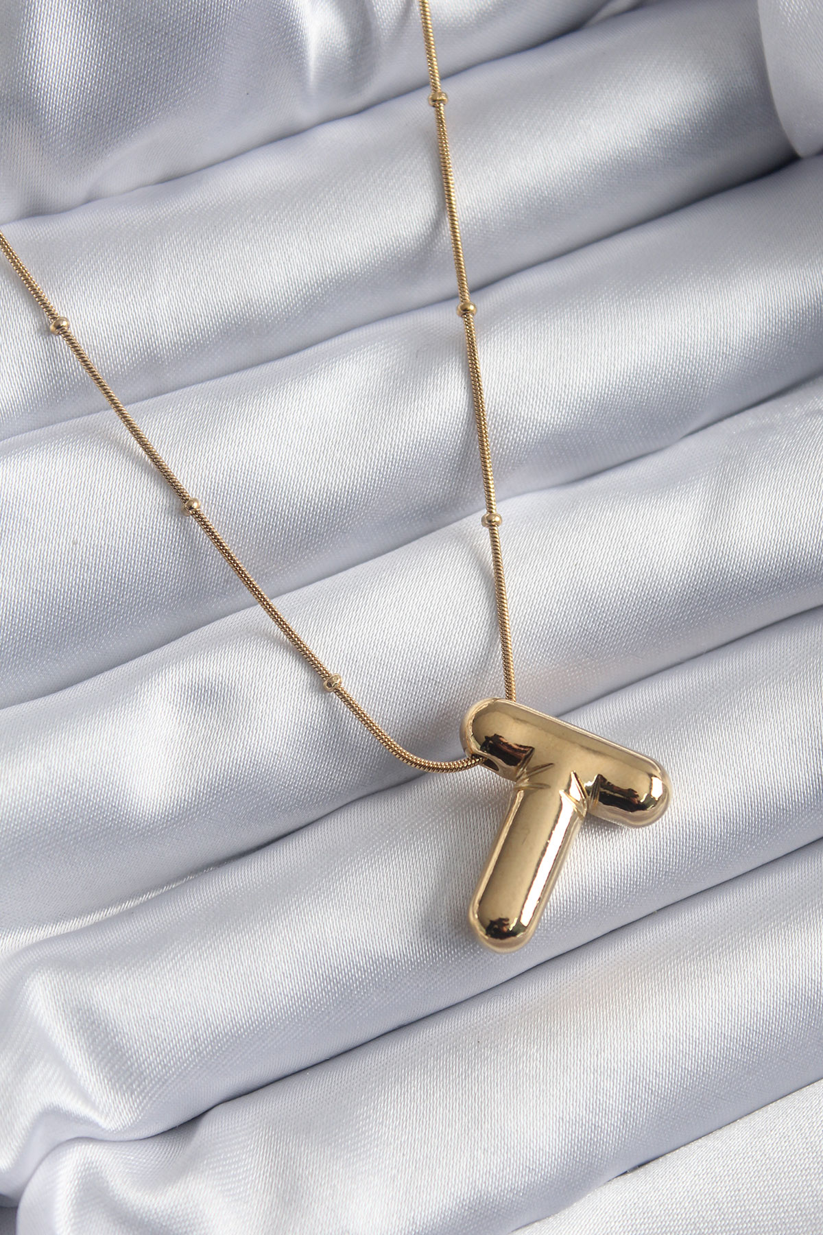 316L Çelik Gold Renk Bubble "T" Harf Model Kadın Kolye 5886 1 316L Çelik Gold Renk Bubble "T" Harf Model Kadın Kolye 5886